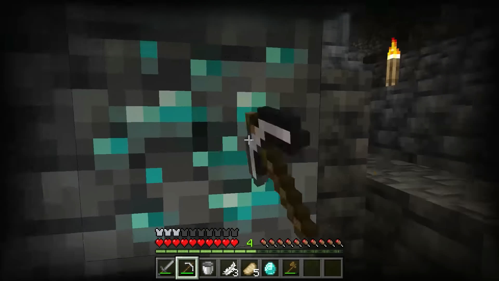 Player mining diamonds in a Minecraft cave